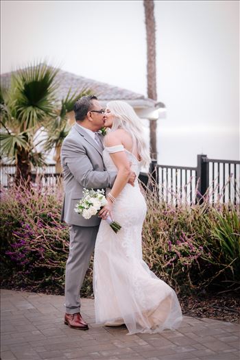 Rainy day wedding at the Shore Cliff Hotel Gazebo in Pismo Beach, California in San Luis Obispo County by Mirror's Edge Photography.  Beautiful wedding gazebo bride and groom on a rainy day in Pismo Beach.