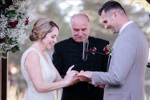 Sarah Williams of Mirror's Edge Photography, a San Luis Obispo and Central Coast Wedding Photographer, captures Christiana and Istvan's Cypress Ridge Pavilion Wedding. Bride and Groom exchanging rings.