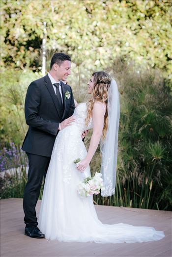 Mirror's Edge Photography, a San Luis Obispo Wedding and Engagement Photographer, captures Rashel and Brian's Wedding Day at the Madonna Inn in San Luis Obispo. Romantic dip by the lake.