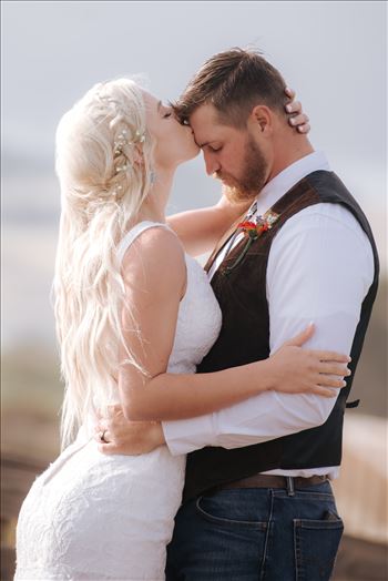 Mirror's Edge Photography, a San Luis Obispo County Wedding and Engagement Photographer, captures Sarah and Jeremy's intimate wedding on Pismo State Beach in Grover Beach, California.  Bride and Groom special moment with Pismo in background