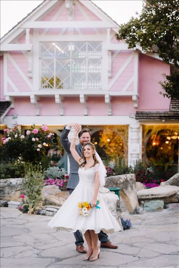 Mirror's Edge Photography captures Sarah and David's magical Madonna Inn Wedding in San Luis Obispo, California.  Bride and Groom dancing in front of Madonna Inn Restaurant.