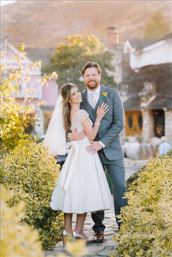 Mirror's Edge Photography captures Sarah and David's magical Madonna Inn Wedding in San Luis Obispo, California.  Bride and Groom in the afternoon light in front of the round room.