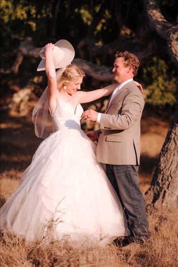 Sarah Williams of Mirror's Edge Photography, a San Luis Obispo and Santa Barbara County Wedding and Engagement Photographer, captures Katie and Joe's country chic wedding in Lompoc, California.  Country Bride and Groom with Bride wearing Cowboy hat.