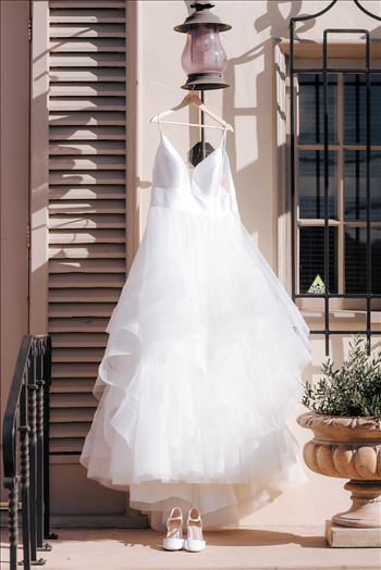 Sarah Williams of Mirror's Edge Photography, a San Luis Obispo County Wedding and Engagement Photographer, captures the amazing wedding of Justine and Reece at the Monday Club in San Luis Obispo California. The Dress hanging