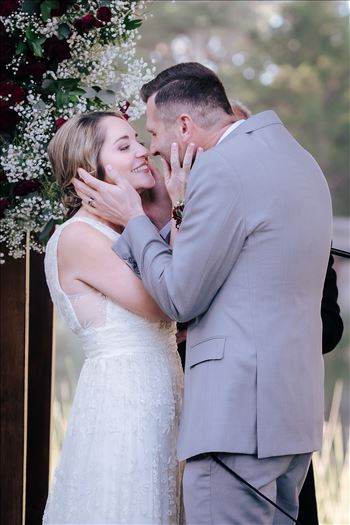 Sarah Williams of Mirror's Edge Photography, a San Luis Obispo and Central Coast Wedding Photographer, captures Christiana and Istvan's Cypress Ridge Pavilion Wedding. Bride and Groom kiss.
