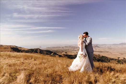 Los Osos Private Ranch Wedding in San Luis Obispo County.  Gorgeous views of Morro Rock and golden hills.  Country wedding with boho flair.  Bride and Groom on a mountaintop.