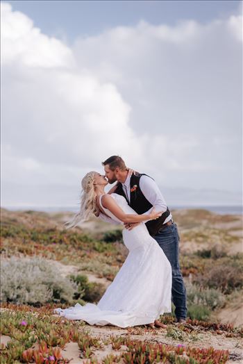 Mirror's Edge Photography, a San Luis Obispo County Wedding and Engagement Photographer, captures Sarah and Jeremy's intimate wedding on Pismo State Beach in Grover Beach, California.  Bride and Groom dip with ocean in the background