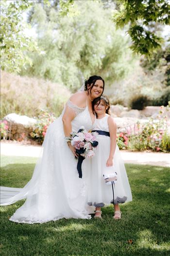 Mirror's Edge Wedding Photography, a San Luis Obispo and Santa Barbara County photographer capture the Nagy's Madonna Inn Wedding. Flower Girl and the Bride.